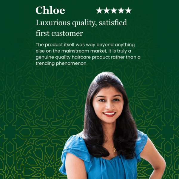A woman with long dark hair and a blue blouse smile in front of Z Secrets green Zelieg patterned background with a five-star review and testimonial about a haircare product.