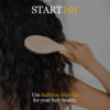 Person brushing curly hair with a Z Secrets bamboo brush; text reads "START 101: Use Z Secrets Bamboo Boar Bristles brushes for your hair health.